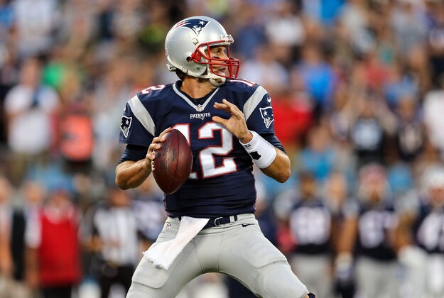 Aug 28, 2015; Charlotte, NC, USA; New England Patriots quarterback Tom Brady (12) drops back to pass during the first quarter at Bank of America Stadium. Mandatory Credit: Jim Dedmon-USA TODAY Sports