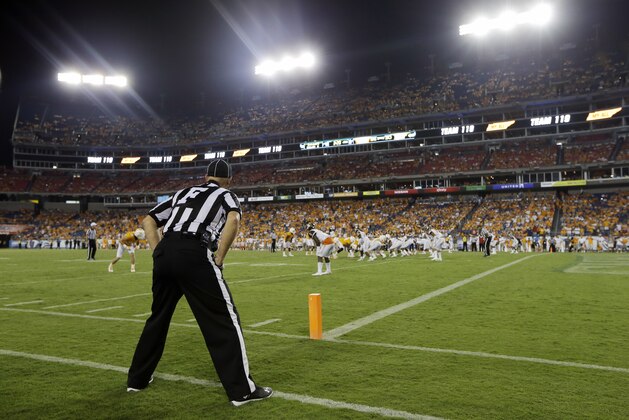 An official watches the action in the second half of an NCAA college football game between Tennessee and Bowling Green in Nissan Stadium Saturday, Sept. 5, 2015, in Nashville, Tenn. Tennessee won 59-30. (AP Photo/Mark Humphrey)