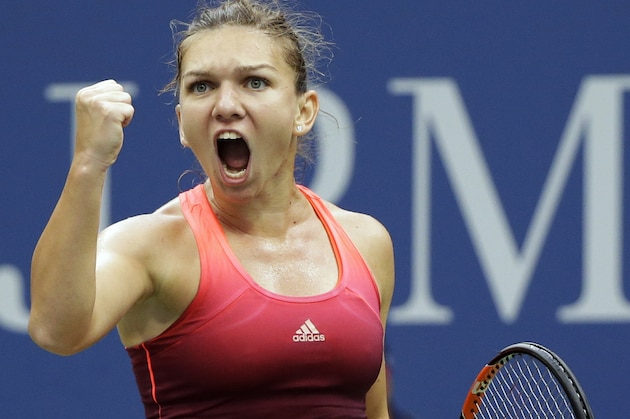 Simona Halep, of Romania, reacts after taking a game from Victoria Azarenka, of Belarus, during the third set of a quarterfinal match at the U.S. Open tennis tournament, Wednesday, Sept. 9, 2015, in New York. (AP Photo/Seth Wenig)