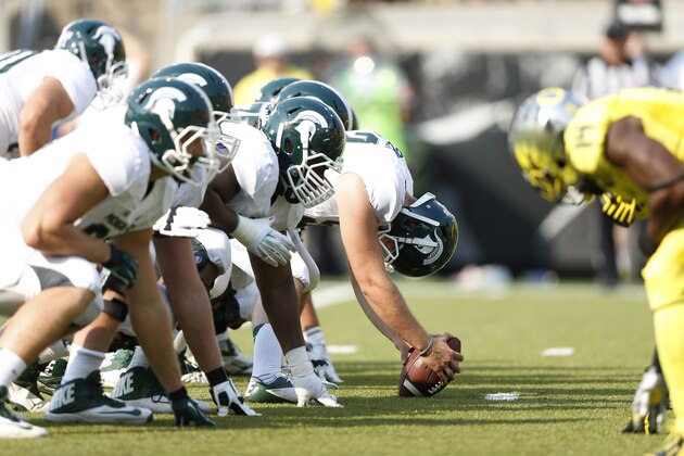 EUGENE, OR - SEPTEMBER 6: The Michigan State Spartans face off at the line of scrimmage against the Oregon Ducks during the game at Autzen Stadium on September 6, 2014 in Eugene, Oregon. Oregon won 46-27. (Photo by Joe Robbins/Getty Images)