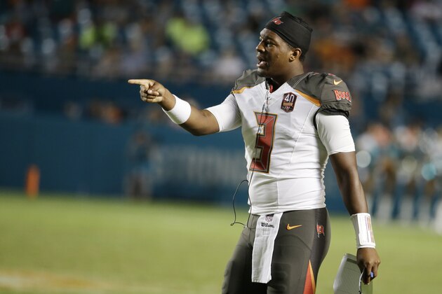 Tampa Bay Buccaneers quarterback Jameis Winston (3) cheers his team during the second half of an NFL preseason football game against the Miami Dolphins, Thursday, Sept. 3, 2015, in Miami Gardens, Fla. (AP Photo/Lynne Sladky)