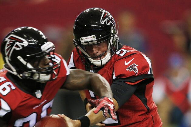 Atlanta Falcons quarterback Matt Ryan (2) hands the ball to Atlanta Falcons running back Tevin Coleman (26) during the first half of an NFL football preseason game against the Baltimore Ravens, Thursday, Sept. 3, 2015, in Atlanta. (AP Photo/John Bazemore)