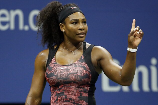 Serena Williams challenges a call during a quarterfinal match against Venus Williams at the U.S. Open tennis tournament, Tuesday, Sept. 8, 2015, in New York. (AP Photo/Julio Cortez)