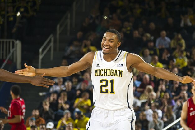 Michigan guard Zak Irvin (21) celebrates after making successive three point baskets, in the first half of an NCAA college basketball game against Nebraska at Crisler Center in Ann Arbor, Mich., Wednesday, Feb. 5, 2014. (AP Photo/Tony Ding) Michigan guard Zak Irvin (21) celebrates after making successive three point baskets, in the first half of an NCAA college basketball game against Nebraska at Crisler Center in Ann Arbor, Mich., Wednesday, Feb. 5, 2014. (AP Photo/Tony Ding)