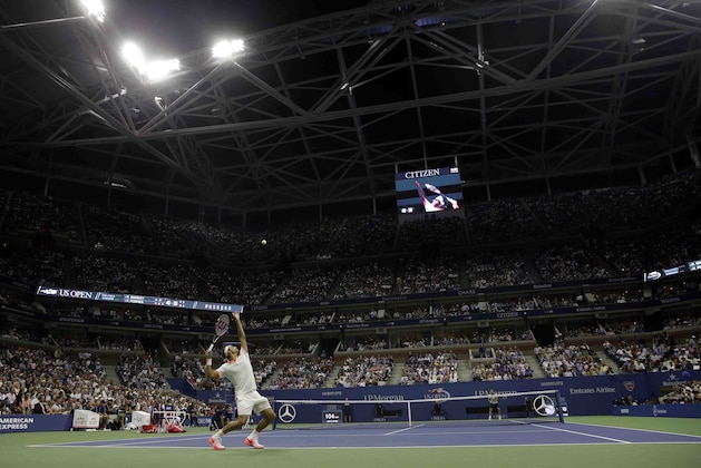Roger Federer, of Switzerland, serves to Richard Gasquet, of France, during a quarterfinal match at the U.S. Open tennis tournament, Wednesday, Sept. 9, 2015, in New York. (AP Photo/Seth Wenig)