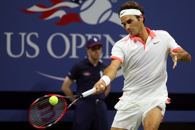 Roger Federer, of Switzerland, returns a shot to Richard Gasquet, of France, during a quarterfinal match at the U.S. Open tennis tournament, Wednesday, Sept. 9, 2015, in New York. (AP Photo/Adam Hunger)