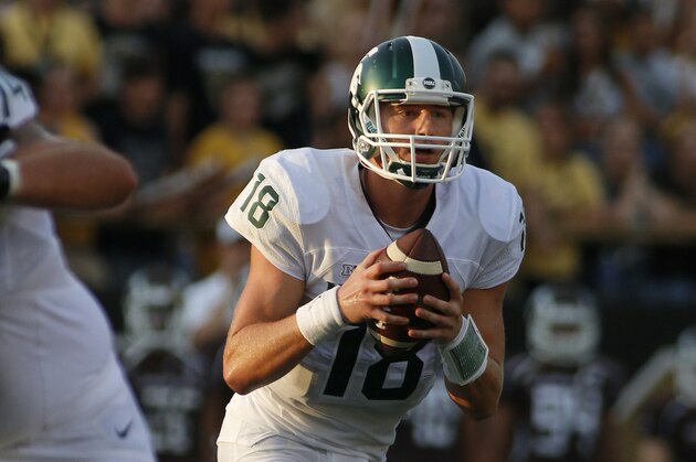 Michigan State quarterback Connor Cook rolls out against Western Michigan during the first quarter of an NCAA college football game, Friday, Sept. 4, 2015, in Kalamazoo, Mich. (AP Photo/Al Goldis)