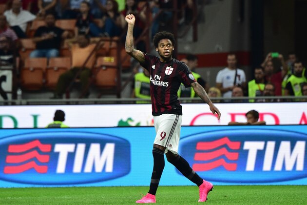 AC Milan's forward from Brazil Luiz Adriano celebrates after scoring a goal during the Italian Serie A football match between AC Milan and Empoli  at San Siro Stadium in Milan on August 29, 2015. AFP PHOTO / GIUSEPPE CACACE        (Photo credit should read GIUSEPPE CACACE/AFP/Getty Images)