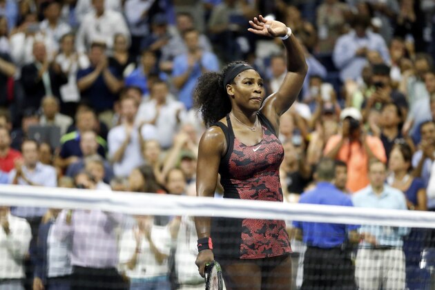Serena Williams waves to the crowd after beating Venus Williams during a quarterfinal match at the U.S. Open tennis tournament, Tuesday, Sept. 8, 2015, in New York. (AP Photo/Julio Cortez)