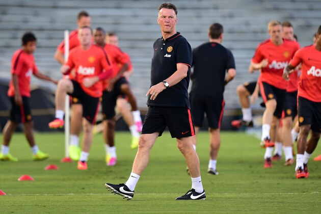 Manchester United's new coach Louis van Gaal walks across the pitch as his player perform drills during a training session at the Rose Bowl in Pasadena, California, on July 22, 2014, where the English Premier League side plays Major League Soccer's LA Galaxy with van Gaal at the helm for the first time on July 23. AFP PHOTO/Frederic J. Brown        (Photo credit should read FREDERIC J. BROWN/AFP/Getty Images)