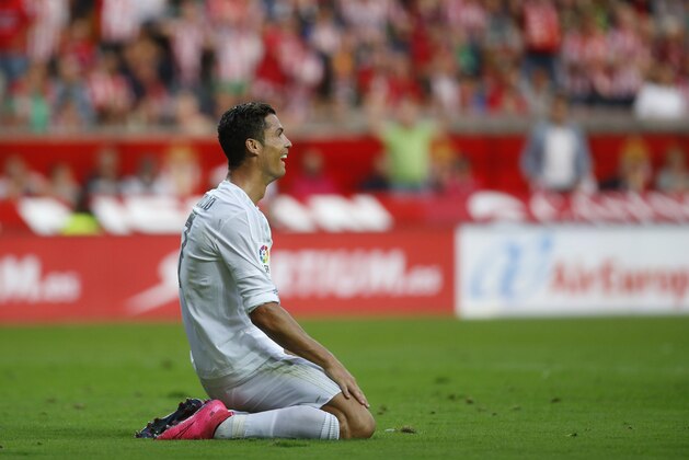Real Madrid's Cristiano Ronaldo reacts during a Spanish La Liga soccer match between Real Madrid and Sporting de Gijon at the 'El Molinon' stadium in Gijon, Spain, Sunday, Aug. 23, 2015. (AP Photo/Jose Vicente)