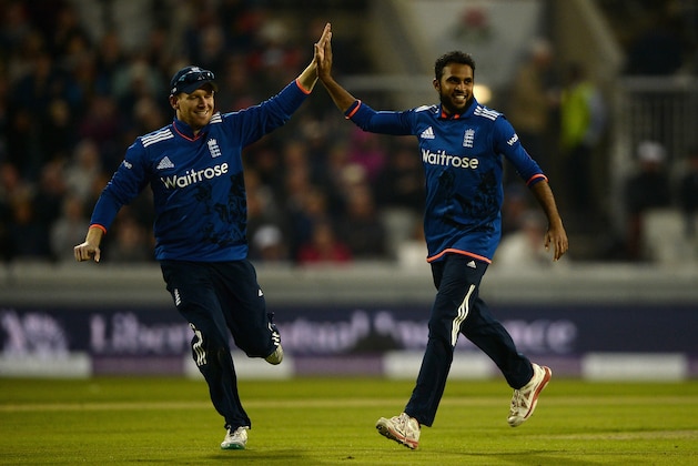 MANCHESTER, ENGLAND - SEPTEMBER 08:  Adil Rashid of England celebrates with England captain Eoin Morgan after dismissing Aaron Finch of Australia during the 3rd Royal London One-Day International match between England and Australia at Old Trafford on September 8, 2015 in Manchester, United Kingdom.  (Photo by Gareth Copley/Getty Images)