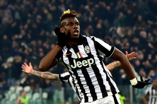 Juventus' midfielder from France Paul Pogba celebrates after scoring a goal during the Serie A football match Juventus vs Sassuolo at 'Juventus Stadium' in Turin on March 09, 2015. AFP PHOTO / GIUSEPPE CACACE        (Photo credit should read GIUSEPPE CACACE/AFP/Getty Images)