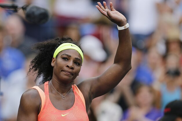 Serena Williams, of the United States, waves to fans after winning her match with Madison Keys, of the United States, during the fourth round of the U.S. Open tennis tournament, Sunday, Sept. 6, 2015, in New York. (AP Photo/Charles Krupa)