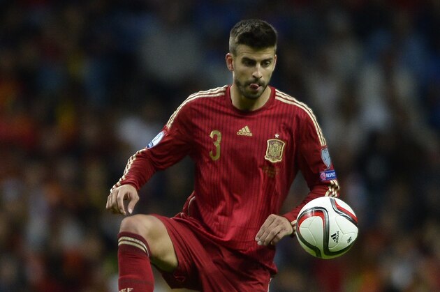 Spain´s defender Gerard Pique controls the ball during the Euro 2016 qualifying football match Spain vs Slovakia at the Carlos Tartiere stadium in Oviedo on September 5, 2015. Spain won the match 2-0.  AFP PHOTO/ MIGUEL RIOPA        (Photo credit should read MIGUEL RIOPA/AFP/Getty Images)