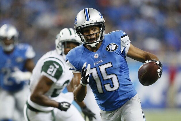 Detroit Lions wide receiver Golden Tate pulls ahead of New York Jets defensive back Marcus Gilchrist for a touchdown during the first half of an NFL preseason football game, Thursday, Aug. 13, 2015, in Detroit. (AP Photo/Rick Osentoski)