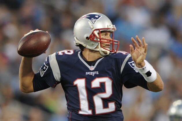 New England Patriots' Tom Brady (12) looks to pass against the Carolina Panthers during the first half of a preseason NFL football game in Charlotte, N.C., Friday, Aug. 28, 2015. (AP Photo/Mike McCarn)