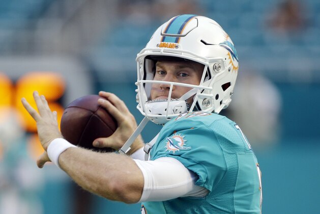 Miami Dolphins quarterback Ryan Tannehill (17) warms up before an NFL preseason football game against the Tampa Bay Buccaneers, Thursday, Sept. 3, 2015 in Miami Gardens, Fla.  (AP Photo/Wilfredo Lee)