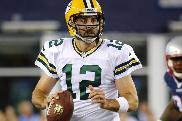 Green Bay Packers quarterback Aaron Rodgers scrambles against the New England Patriots during a NFL preseason football game at Gillette Stadium in Foxborough, Mass. Friday, Aug. 13, 2015. Green Bay beat New England 22-11. (Winslow Townson/AP Images for Panini)