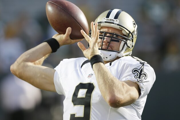 New Orleans Saints quarterback Drew Brees throws before a preseason NFL football game against the Green Bay Packers Thursday, Sept. 3, 2015, in Green Bay, Wis. (AP Photo/Jeffrey Phelps)