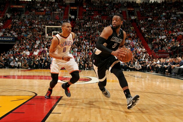 MIAMI, FL - JANUARY 20: Dwyane Wade #3 of the Miami Heat Russell Westbrook #0 of the Oklahoma City Thunder on January 20, 2015 at American Airlines Arena in Miami, Florida. NOTE TO USER: User expressly acknowledges and agrees that, by downloading and or using this Photograph, user is consenting to the terms and conditions of the Getty Images License Agreement. Mandatory Copyright Notice: Copyright 2015 NBAE (Photo by Isaac Baldizon/NBAE via Getty Images)