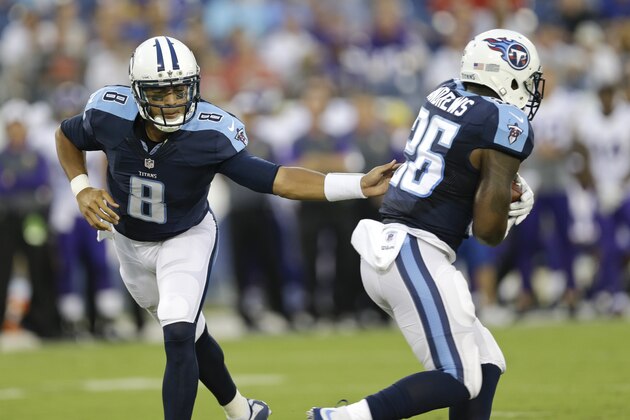 Tennessee Titans quarterback Marcus Mariota (8) hands off to running back Antonio Andrews (26) in the first half of a preseason NFL football game against the Minnesota Vikings Thursday, Sept. 3, 2015, in Nashville, Tenn. (AP Photo/James Kenney)