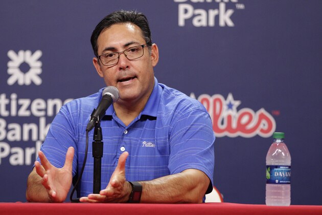 Philadelphia Phillies Senior Vice President & General Manager Ruben Amaro Jr. takes questions from the media after trading starting pitcher Cole Hamels  prior to the first inning of a baseball game against the Atlanta Braves, Friday, July 31, 2015, in Philadelphia. (AP Photo/Chris Szagola)