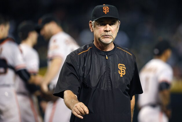 San Francisco Giants manager Bruce Bochy walks off the field after making a pitching change during the seventh inning of a baseball game against the Arizona Diamondbacks Tuesday, Sept. 8, 2015, in Phoenix.  The Giants defeated the Diamondbacks 6-2. (AP Photo/Ross D. Franklin)