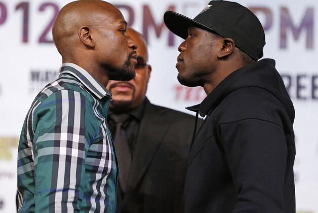 Floyd Mayweather Jr., left, and Andre Berto pose for photographers during a news conference Wednesday, Sept. 9, 2015, in Las Vegas. The two are scheduled to fight Saturday in Las Vegas. (AP Photo/John Locher)