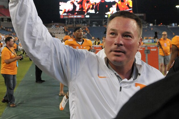 Sep 5, 2015; Nashville, TN, USA; Tennessee Volunteers head coach Butch Jones waves to fans as he departs the field after his team defeated the Bowling Green Falcons  during the second half at Nissan Stadium. Tennessee won 59-30. Mandatory Credit: Jim Brown-USA TODAY Sports