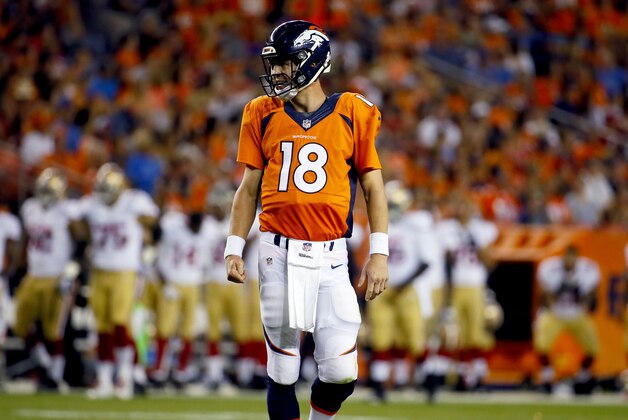 Denver Broncos quarterback Peyton Manning (18) walks off the field against the San Francisco 49ers during the first half of an NFL preseason football game, Saturday, Aug. 29, 2015, in Denver. (AP Photo/Jack Dempsey)