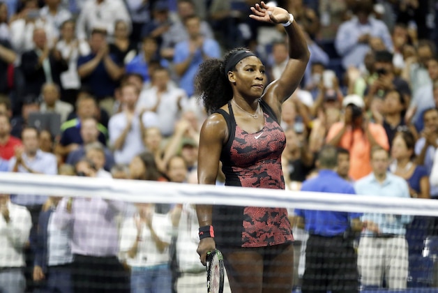 Serena Williams waves to the crowd after beating Venus Williams during a quarterfinal match at the U.S. Open tennis tournament, Tuesday, Sept. 8, 2015, in New York. (AP Photo/Julio Cortez)