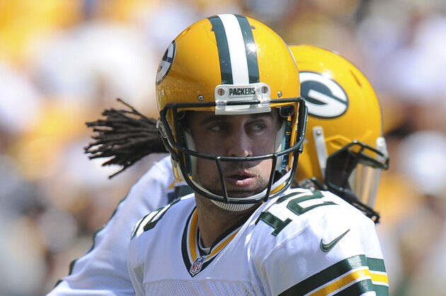 Green Bay Packers quarterback Aaron Rodgers (12) plays in the NFL preseason football game between the Pittsburgh Steelers and the Green Bay Packers, Sunday, Aug. 23, 2015 in Pittsburgh. (AP Photo/Don Wright)
