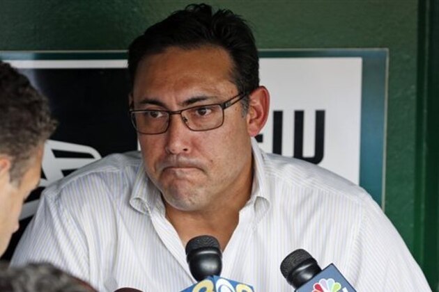 FILE - In this July 31, 2014, file photo, Philadelphia Phillies general manager Ruben Amaro Jr. pauses while speaking to reporters before a Phillies baseball game against the Washington Nationals in Washington. The Phillies have fired general manager Ruben Amaro Jr. President in-waiting Andy MacPhail made the announcement Thursday, Sept. 10, 2015. Assistant General Manager Scott Proefrock replaces Amaro as interim GM. (AP Photo/Alex Brandon, File)