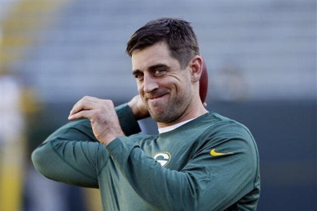 FILE - In this Sept. 3, 2015, file photo, Green Bay Packers quarterback Aaron Rodgers warms up before a preseason NFL football game against the New Orleans Saints in Green Bay, Wis. Packers quarterback Aaron Rodgers will start promoting Adidas products under a multiyear partnership announced Thursday, Sept. 10, 2015, by the sneaker and sports apparel giant.(AP Photo/Mike Roemer, File)