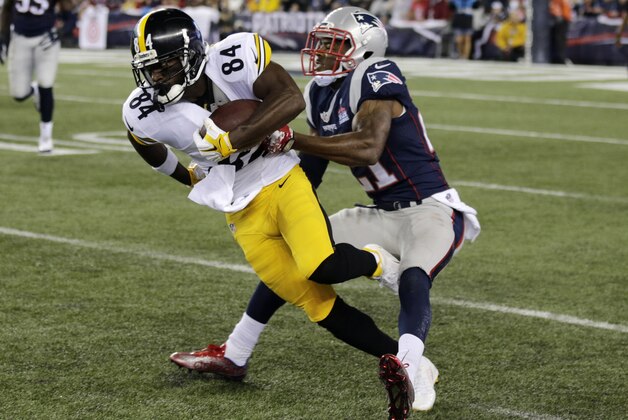 Pittsburgh Steelers wide receiver Antonio Brown (84) slips from the grasp of New England Patriots safety Malcolm Butler (21) in the first half of an NFL football game, Thursday, Sept. 10, 2015, in Foxborough, Mass. (AP Photo/Charles Krupa)