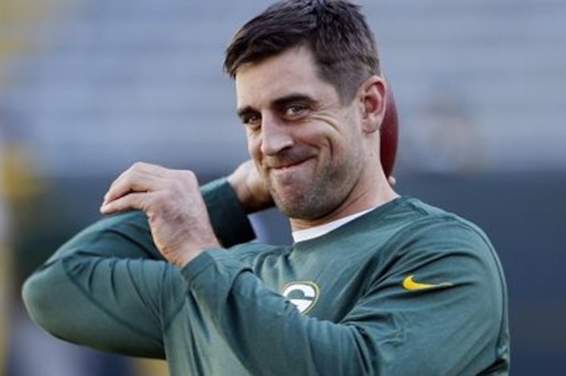 FILE - In this Sept. 3, 2015, file photo, Green Bay Packers quarterback Aaron Rodgers warms up before a preseason NFL football game against the New Orleans Saints in Green Bay, Wis. Packers quarterback Aaron Rodgers will start promoting Adidas products under a multiyear partnership announced Thursday, Sept. 10, 2015, by the sneaker and sports apparel giant.(AP Photo/Mike Roemer, File)