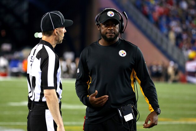 FOXBORO, MA - SEPTEMBER 10:  Head coach Mike Tomlin of the Pittsburgh Steelers speaks to an official in the first half against the New England Patriots at Gillette Stadium on September 10, 2015 in Foxboro, Massachusetts.  (Photo by Jim Rogash/Getty Images)