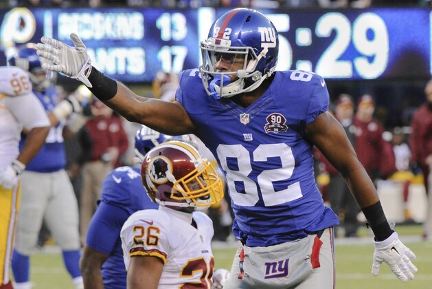 New York Giants wide receiver Rueben Randle (82) reacts after gaining a first down against the Washington Redskins during the fourth quarter of an NFL football game, Sunday, Dec. 14, 2014, in East Rutherford, N.J. (AP Photo/Bill Kostroun)
