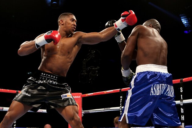 LONDON, ENGLAND - MAY 30:  Anthony Joshua of England and Kevin Johnson of The USA exchange blows during their WBC International Heavyweight bout at The O2 Arena on May 30, 2015 in London, England.  (Photo by Ben Hoskins/Getty Images)