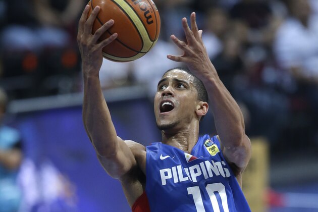 The Philippines Gabriel Daniel Norwood, right, attempts a shot against Hong Kong's Lee Ki  in the FIBA Asia Basketball Championship game at the Mall of Asia Arena, south of Manila, Philippines, Wednesday, Aug.7, 2013. The Philippines won 67-55. (AP Photo/Bullit Marquez)