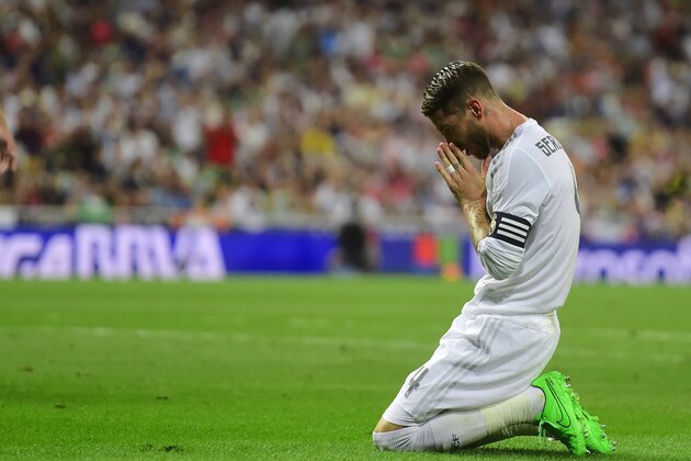 Real Madrid's defender Sergio Ramos reacts during the Spanish league football match Real Madrid CF vs Real Betis Balompie at the Santiago Bernabeu stadium in Madrid on August 29, 2015.   AFP PHOTO/ PIERRE-PHILIPPE MARCOU        (Photo credit should read PIERRE-PHILIPPE MARCOU/AFP/Getty Images)