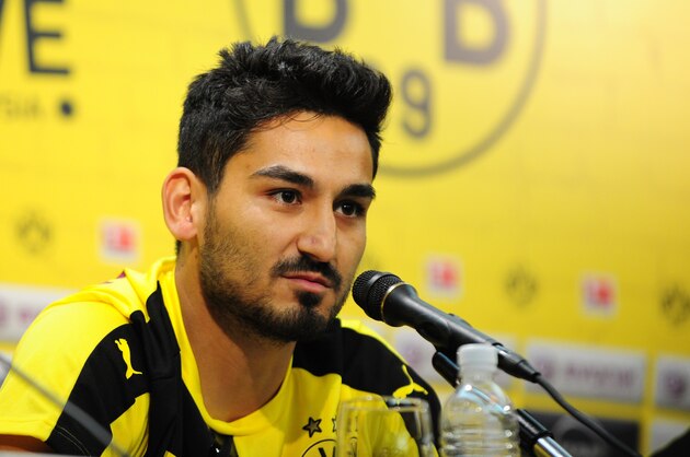 Ilkay Gundogan of Borussia Dortmund attends a football press conference in Singapore on July 8, 2015. Borussia Dortmund's Asia Tour includes stops in Japan, Singapore and Malaysia. AFP PHOTO /MOHD FYROL (Photo credit should read MOHD FYROL/AFP/Getty Images) Ilkay Gundogan of Borussia Dortmund attends a football press conference in Singapore on July 8, 2015. Borussia Dortmund's Asia Tour includes stops in Japan, Singapore and Malaysia. AFP PHOTO /MOHD FYROL (Photo credit should read MOHD FYROL/AFP/Getty Images)