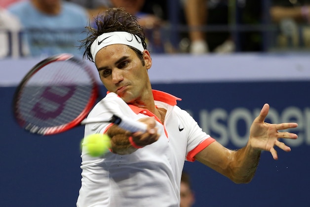Roger Federer, of Switzerland, returns a shot to Richard Gasquet, of France, during a quarterfinal match at the U.S. Open tennis tournament, Wednesday, Sept. 9, 2015, in New York. (AP Photo/Adam Hunger)