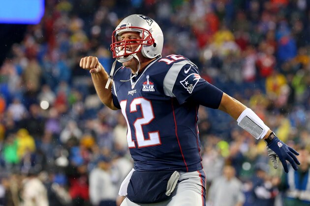 FOXBORO, MA - SEPTEMBER 10:  Tom Brady #12 of the New England Patriots cheers as he runs on to the field before the game against the Pittsburgh Steelers at Gillette Stadium on September 10, 2015 in Foxboro, Massachusetts.  (Photo by Jim Rogash/Getty Images)