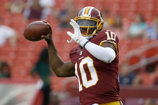 Washington Redskins quarterback Robert Griffin III (10) warms up before an NFL football game against the Detroit Lions in Landover, Md., Thursday, Aug. 20, 2015. (AP Photo/Alex Brandon)