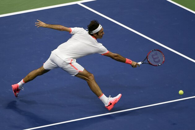 Roger Federer, of Switzerland, chases a shot by Richard Gasquet, of France, during a quarterfinal match at the U.S. Open tennis tournament, Wednesday, Sept. 9, 2015, in New York. (AP Photo/Kathy Kmonicek)