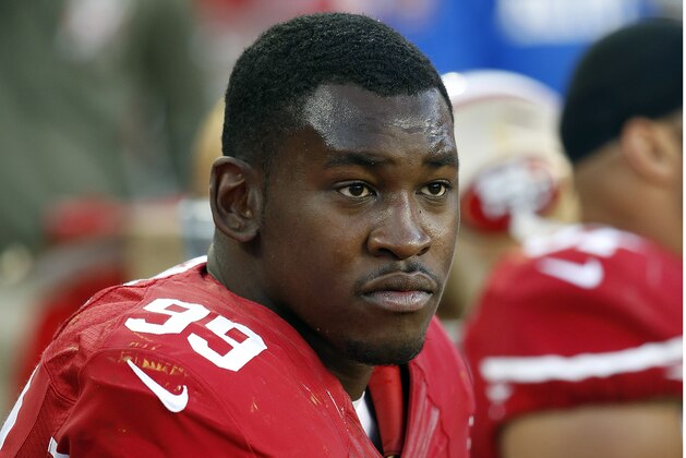 FILE - In this Nov. 23, 2014, file photo, San Francisco 49ers linebacker Aldon Smith sits on the bench during the second half of an NFL football game against the Washington Redskins in Santa Clara, Calif. The Oakland Raiders have signed the troubled pass rusher on Friday, Sept. 12, 2015. Smith was released last month by the 49ers a day after his fifth legal run-in since being drafted in 2011. (AP Photo/Tony Avelar, File)