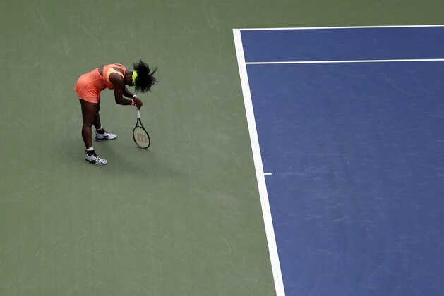 Serena Williams reacts after losing a point to Roberta Vinci, of Italy, during a semifinal match at the U.S. Open tennis tournament, Friday, Sept. 11, 2015, in New York. (AP Photo/Seth Wenig)