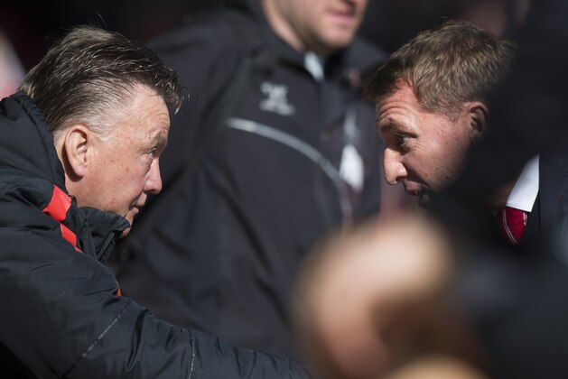 Manchester United's manager Louis van Gaal, left, greets Liverpool's manager Brendan Rodgers before the English Premier League soccer match between Liverpool and Manchester United at Anfield Stadium, Liverpool, England, Sunday, March 22, 2015. (AP Photo/Jon Super)